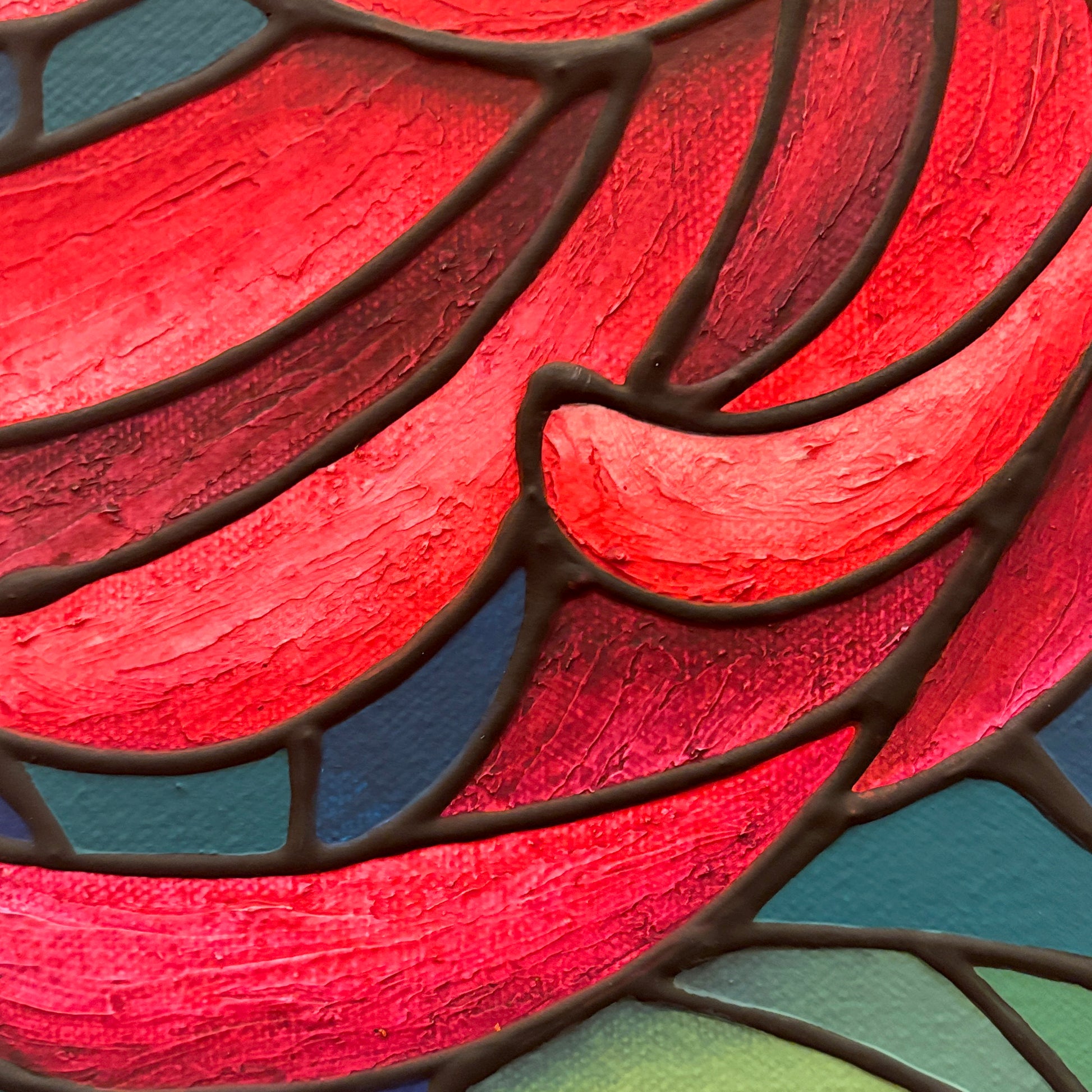 Close-up of a colorful stained glass chrysanthemum flower painting with magenta, blue, and green hues.