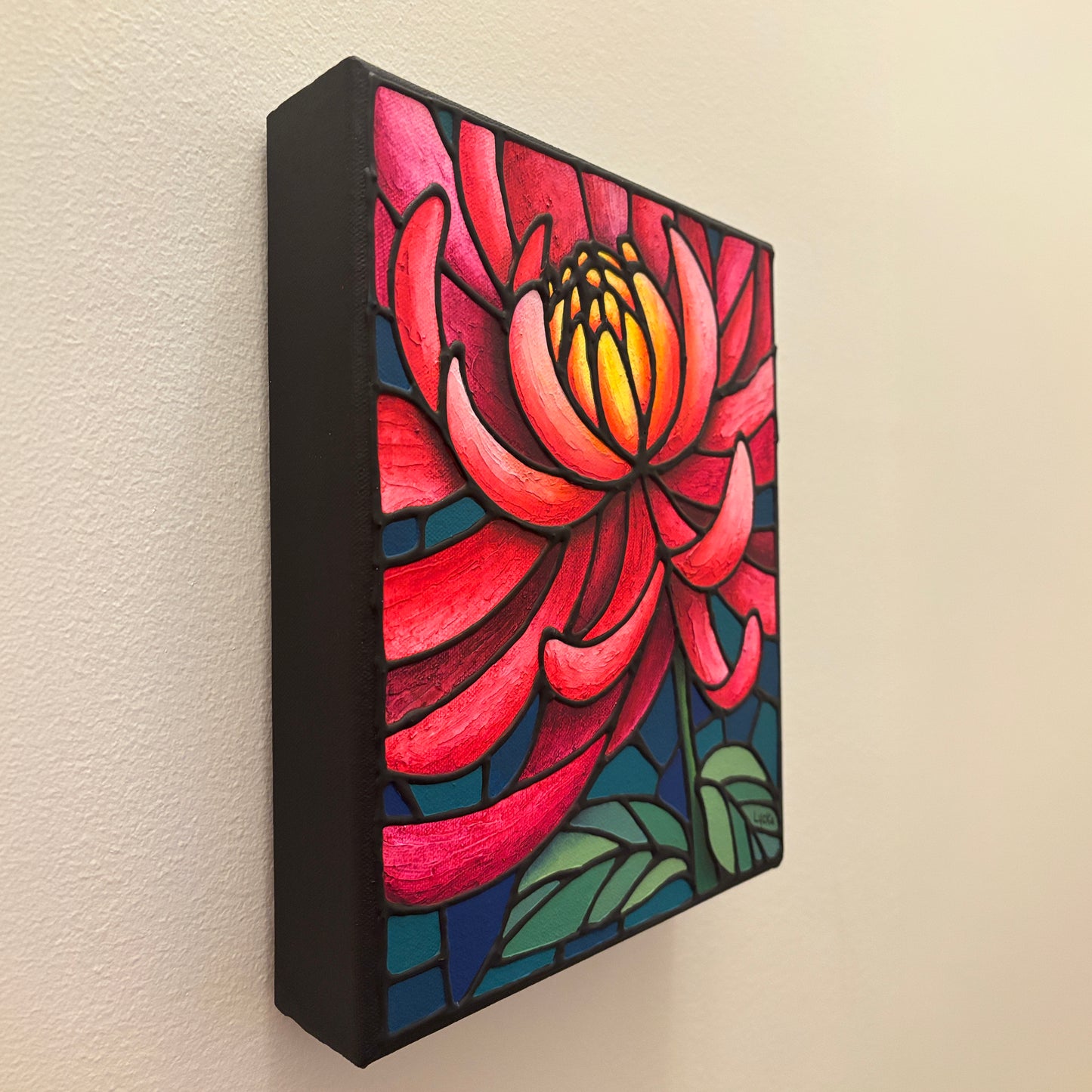 Colorful, original pink chrysanthemum floral artwork on a beige wall